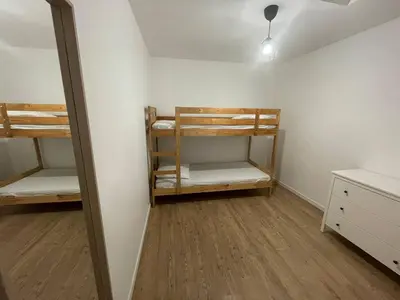 Un ou plusieurs lits dans un hébergement de l'établissement Borne arcade, Billard, Fléchettes & Sauna 6pers