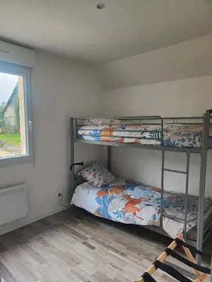 Un ou plusieurs lits dans un hébergement de l'établissement Gîte 6 personnes