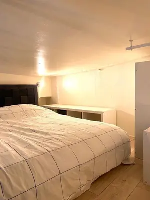 Un ou plusieurs lits dans un hébergement de l'établissement Magnolia Home
