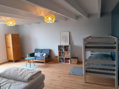 Un ou plusieurs lits dans un hébergement de l'établissement Family home for 14 people