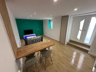 Télévision ou salle de divertissement dans l'établissement Appartement granville