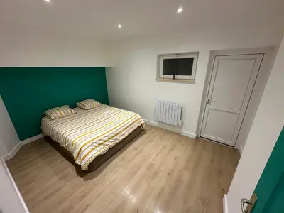 Un ou plusieurs lits dans un hébergement de l'établissement Appartement granville