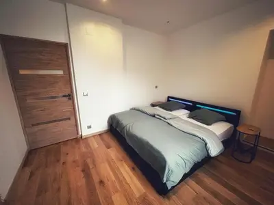 Un ou plusieurs lits dans un hébergement de l'établissement Grande maison moderne 5 chambres