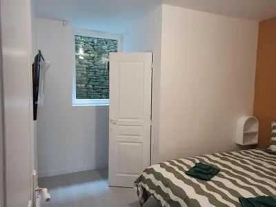 Un ou plusieurs lits dans un hébergement de l'établissement Appartement 2 à 4 personnes proche de la mer