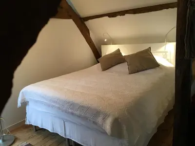 Un ou plusieurs lits dans un hébergement de l'établissement Studio des Perriots