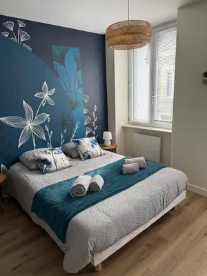 Un ou plusieurs lits dans un hébergement de l'établissement Appartement lumineux design 2 chambres centre et Cité de la Mer