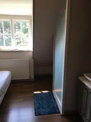 Un ou plusieurs lits dans un hébergement de l'établissement La Farandole, coastal family home