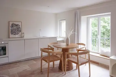 Cuisine ou kitchenette dans l'établissement Les Voiles Blanches - Appartement dans un château