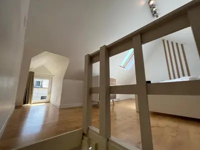 Un ou plusieurs lits dans un hébergement de l'établissement Cosy Duplex séjour duo ou petite famille Situation centrale - proche plage & commerces - Wifi et linge inclus