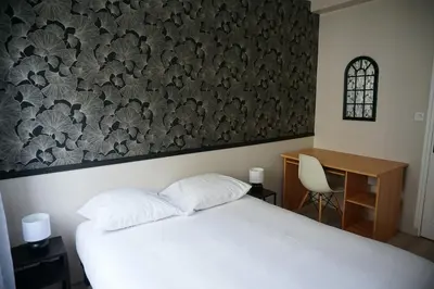 Un ou plusieurs lits dans un hébergement de l'établissement Appartement confortable