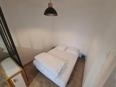 Un ou plusieurs lits dans un hébergement de l'établissement Superbe appartement