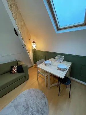 Coin salon dans l'établissement Un cocon au Presbytère avec place de parking voiture gratuite