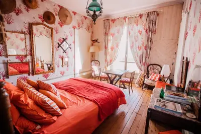 Un ou plusieurs lits dans un hébergement de l'établissement La Villa Louis, maison d'hôtes, vue mer