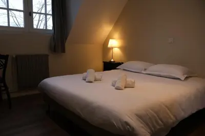 Un ou plusieurs lits dans un hébergement de l'établissement Domaine La Grande Bruyère