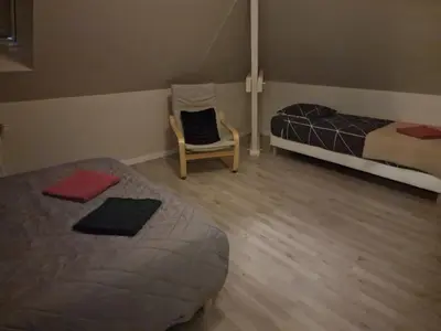 Un ou plusieurs lits dans un hébergement de l'établissement Maison 5 chambres