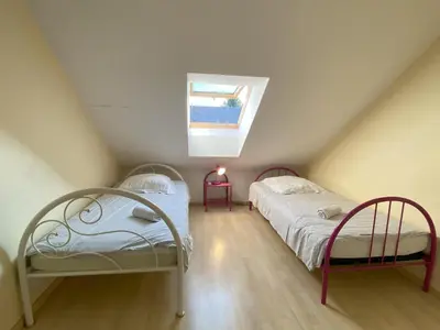 Un ou plusieurs lits dans un hébergement de l'établissement Holiday Home in Kairon near the Beach