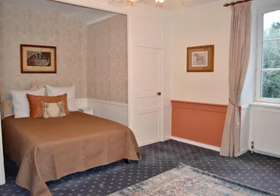 Un ou plusieurs lits dans un hébergement de l'établissement Country House La Feronnière