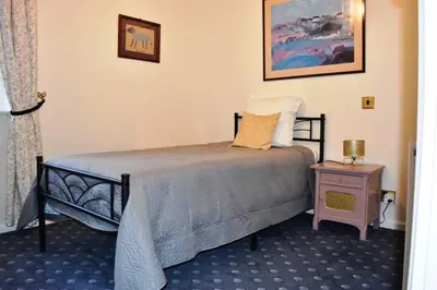Un ou plusieurs lits dans un hébergement de l'établissement Country House La Feronnière