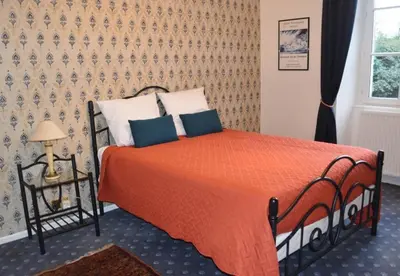 Un ou plusieurs lits dans un hébergement de l'établissement Country House La Feronnière
