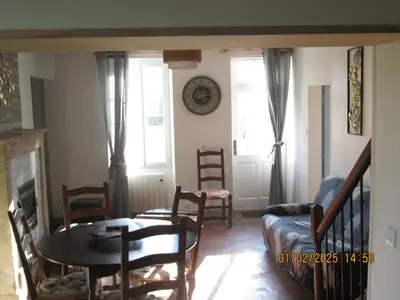 Coin salon dans l'établissement maison des trois rivières