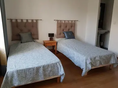Un ou plusieurs lits dans un hébergement de l'établissement Maison Tirlibibi