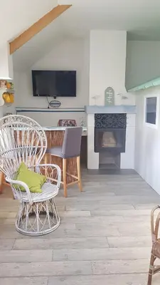 Télévision ou salle de divertissement dans l'établissement Gîte Esprit Mer