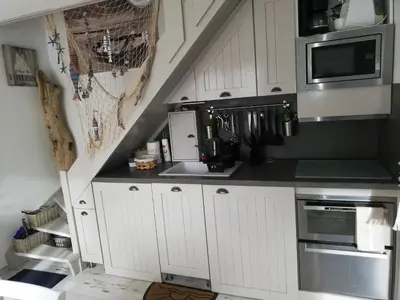 Cuisine ou kitchenette dans l'établissement Brise Marine