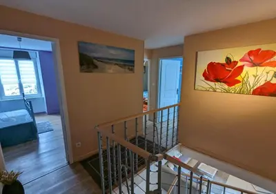 Un ou plusieurs lits dans un hébergement de l'établissement GITE PAMPHILIENNE VUE MONT SAINT MICHEL et CAMPAGNE NORMANDE