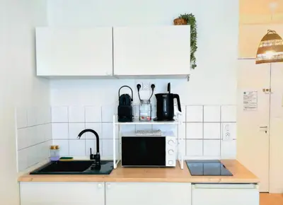 Cuisine ou kitchenette dans l'établissement Charmant Studio Vie Caennaise au Port & Vaugueux