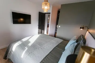 Un ou plusieurs lits dans un hébergement de l'établissement Appartement historique Dior