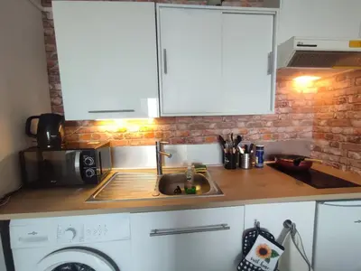 Cuisine ou kitchenette dans l'établissement Appartement vue sur mer & le port de Courseulles-sur-Mer