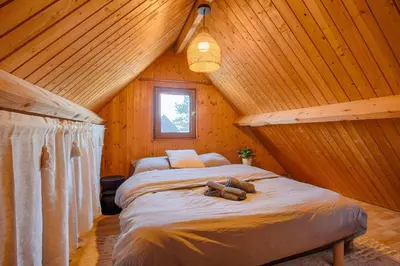 Un ou plusieurs lits dans un hébergement de l'établissement Chalet cosy - Proche mer
