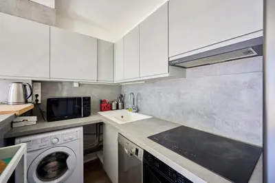 Cuisine ou kitchenette dans l'établissement L'Ancre Bleue - Duplex à 10min de la plage