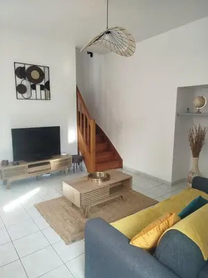 Télévision ou salle de divertissement dans l'établissement Au refuge de la baie