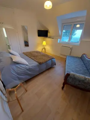 Un ou plusieurs lits dans un hébergement de l'établissement Chambre Alice