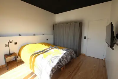 Un ou plusieurs lits dans un hébergement de l'établissement La Bouteille à la Mer-Maison darchitecte jacuzzi