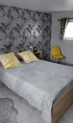 Un ou plusieurs lits dans un hébergement de l'établissement La petite ruette