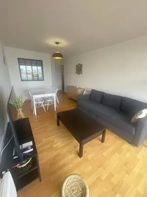 Coin salon dans l'établissement Appartement face au port
