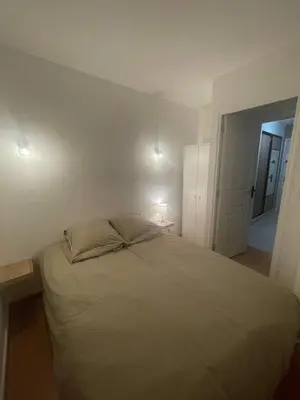Un ou plusieurs lits dans un hébergement de l'établissement Appartement face au port