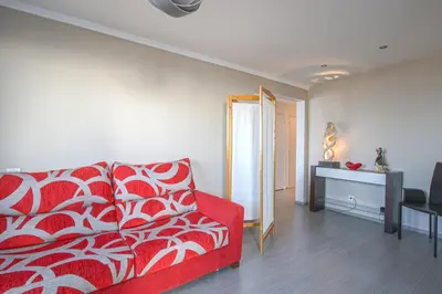 Un ou plusieurs lits dans un hébergement de l'établissement Appartement face à la mer