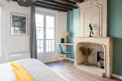 Un ou plusieurs lits dans un hébergement de l'établissement Charming studio - Rue Froide