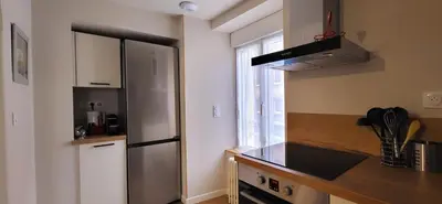 Cuisine ou kitchenette dans l'établissement Le Cosy Home
