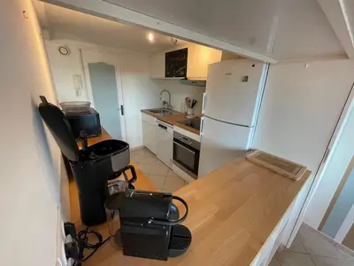 Cuisine ou kitchenette dans l'établissement Appartement Ô Nid Perché Vue mer