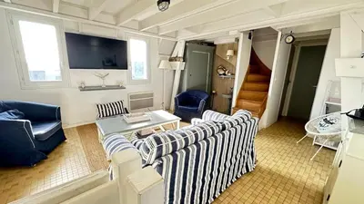 Télévision ou salle de divertissement dans l'établissement Maison des dunes - Proche mer