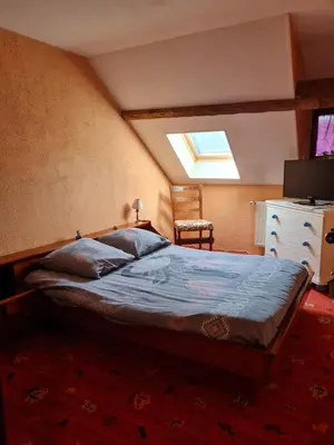 Un ou plusieurs lits dans un hébergement de l'établissement Gîte Ouillypontain