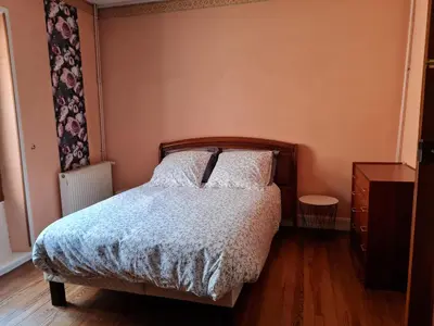 Un ou plusieurs lits dans un hébergement de l'établissement Gîte Ouillypontain