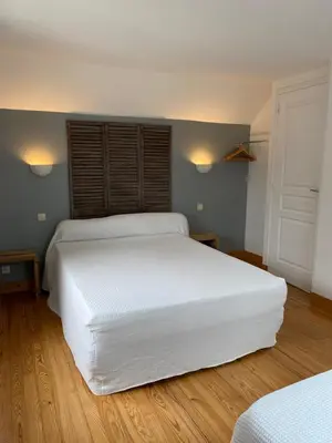 Un ou plusieurs lits dans un hébergement de l'établissement La Petite Maison