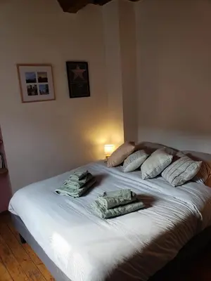 Un ou plusieurs lits dans un hébergement de l'établissement Maison de charme