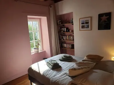 Un ou plusieurs lits dans un hébergement de l'établissement Maison de charme