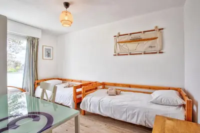 Un ou plusieurs lits dans un hébergement de l'établissement Seafront flat near Cabourg with free private parking